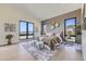 Main bedroom with vaulted ceilings, large windows, and plush bedding at 9737 Majestic Oak Dr, Parker, CO 80134