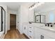 Modern bathroom boasts double vanity, walk-in shower, and soaking tub at 42992 Colonial Trl, Elizabeth, CO 80107