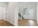 Bright entryway with hardwood floors and modern staircase at 42992 Colonial Trl, Elizabeth, CO 80107
