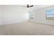 Spacious bedroom featuring wall-to-wall carpet and two windows at 42992 Colonial Trl, Elizabeth, CO 80107