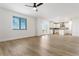 Open living room with hardwood floors and views of the kitchen at 42992 Colonial Trl, Elizabeth, CO 80107