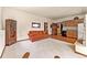 Finished basement features kitchenette, sitting area, and access to other rooms at 8 Yuma Trl, Evergreen, CO 80439