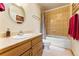 Bathroom with single vanity and shower/tub combo at 8 Yuma Trl, Evergreen, CO 80439