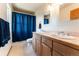 Bathroom with double vanity and shower/tub combo at 8 Yuma Trl, Evergreen, CO 80439