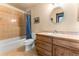 Clean bathroom with a tub, toilet, and light wood vanity at 8 Yuma Trl, Evergreen, CO 80439