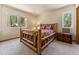 Bedroom with rustic wood bed frame and forest views at 8 Yuma Trl, Evergreen, CO 80439