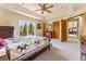 Bright bedroom with access to a private deck and mountain views at 8 Yuma Trl, Evergreen, CO 80439
