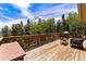 Spacious deck overlooking trees and mountains at 8 Yuma Trl, Evergreen, CO 80439