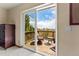 Private deck with wicker furniture and stunning mountain views at 8 Yuma Trl, Evergreen, CO 80439