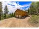 Two-story home with attached two-car garage and mountain views at 8 Yuma Trl, Evergreen, CO 80439