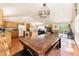 Open kitchen with island and wood cabinets at 8 Yuma Trl, Evergreen, CO 80439