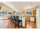 Open kitchen with island and wood cabinets at 8 Yuma Trl, Evergreen, CO 80439