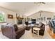 Spacious living room with fireplace and leather furniture at 8 Yuma Trl, Evergreen, CO 80439