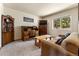 Home office with desk, couch, and large window at 8 Yuma Trl, Evergreen, CO 80439