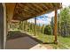 Covered patio with mountain views and a gravel base at 8 Yuma Trl, Evergreen, CO 80439