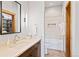 Modern bathroom with tiled shower/tub combo, single vanity, and ample storage at 41 Barton Ridge Dr, Breckenridge, CO 80424