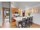 Modern kitchen with wood cabinetry, stainless steel appliances, and an island with seating at 41 Barton Ridge Dr, Breckenridge, CO 80424