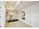 Basement home gym with a treadmill and mirrored wall at 7379 S Ukraine St, Aurora, CO 80016