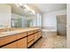 Elegant bathroom with double vanity, soaking tub, and glass shower at 7379 S Ukraine St, Aurora, CO 80016