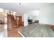 Kitchen view of dining area with grey wash table and stairs at 1109 S Alton Ct, Denver, CO 80247