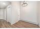 Bright dining area with hardwood floors and a stylish chandelier at 2800 Kalmia Ave # C314, Boulder, CO 80301