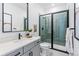 Modern bathroom featuring sleek fixtures, a tiled shower, and green subway tiles at 16514 W 93Rd Way, Arvada, CO 80007