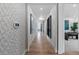 Bright hallway with hardwood flooring and access to other rooms at 16514 W 93Rd Way, Arvada, CO 80007