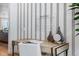 Stylish home office with a patterned wall, desk, and organizational tools at 16514 W 93Rd Way, Arvada, CO 80007