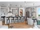 Modern kitchen with gray cabinets, an island with bar seating, and an open layout at 16514 W 93Rd Way, Arvada, CO 80007