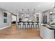 Spacious kitchen with island, bar seating, and an open layout into the dining area at 16514 W 93Rd Way, Arvada, CO 80007