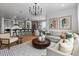 Open-concept living area with a kitchen, dining area, and comfortable seating at 16514 W 93Rd Way, Arvada, CO 80007