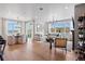 Bright living room with large windows, comfy furniture, and a fireplace at 16514 W 93Rd Way, Arvada, CO 80007