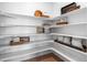 Well-organized pantry with ample shelving space at 16514 W 93Rd Way, Arvada, CO 80007