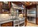 High-end kitchen features professional-grade range and stainless steel hood at 1003 Boreas Pass Rd, Breckenridge, CO 80424