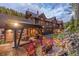Landscaped backyard with fire pit and patio furniture at 1003 Boreas Pass Rd, Breckenridge, CO 80424