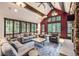 Spacious living room with vaulted ceilings, fireplace, and ample natural light at 1003 Boreas Pass Rd, Breckenridge, CO 80424