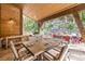 Outdoor patio with a dining table and built in grill at 1003 Boreas Pass Rd, Breckenridge, CO 80424