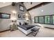 Main bedroom with high ceilings and sitting area at 1003 Boreas Pass Rd, Breckenridge, CO 80424