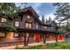 Multi-unit building exterior with stone, wood, and covered walkway at 1003 Boreas Pass Rd, Breckenridge, CO 80424