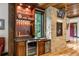 Custom wet bar with wine cooler and granite countertop at 1003 Boreas Pass Rd, Breckenridge, CO 80424
