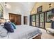 Main bedroom with king-size bed and access to balcony at 1003 Boreas Pass Rd, Breckenridge, CO 80424