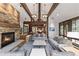 Open living room with stone fireplace and high ceilings at 1003 Boreas Pass Rd, Breckenridge, CO 80424
