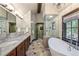 Luxurious bathroom with soaking tub and double vanity at 1003 Boreas Pass Rd, Breckenridge, CO 80424