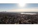 Aerial view with distant city skyline and lake views at 3001 Chase St, Wheat Ridge, CO 80214