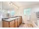 Double vanity bathroom with granite countertop at 5892 W 94Th Pl, Westminster, CO 80031