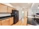 Modern kitchen with granite countertops and black appliances at 5892 W 94Th Pl, Westminster, CO 80031