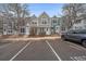 Gray townhome with two-toned siding and landscaping at 10681 W Dartmouth Ave, Lakewood, CO 80227