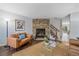 Living room with stone fireplace and hardwood floors at 10681 W Dartmouth Ave, Lakewood, CO 80227