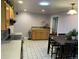 Eat-in kitchen with stainless steel appliances and wood cabinets at 6150 E Kentucky Ave, Denver, CO 80224