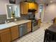 Kitchen with stainless steel appliances and wood cabinets at 6150 E Kentucky Ave, Denver, CO 80224